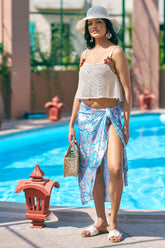 Turn heads in this sky-blue bikini scarf and white crop top set from NovelaFashion. Inspired by Missoni, it’s the perfect beach club or resort outfit—available in sizes XXS to 5XL.