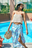 Turn heads in this sky-blue bikini scarf and white crop top set from NovelaFashion. Inspired by Missoni, it’s the perfect beach club or resort outfit—available in sizes XXS to 5XL.