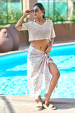 Complete your beach vacation outfits with this off-white crop top and multicolor sarong cover-up. A stylish mix of comfort and elegance, this resort chic attire is perfect for beach club looks. Available in all sizes S–7XL at NovelaFashion.