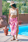 Elevate your beach outfits with this stunning pink sarong and off-white spaghetti top. Perfect as resort chic attire or a beach club outfit, this stylish set is available in all sizes from S to 7XL at NovelaFashion.