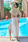 Complete your beach vacation outfits with this off-white crop top and multicolor sarong cover-up. A stylish mix of comfort and elegance, this resort chic attire is perfect for beach club looks. Available in all sizes S–7XL at NovelaFashion.