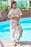 Complete your beach vacation outfits with this off-white crop top and multicolor sarong cover-up. A stylish mix of comfort and elegance, this resort chic attire is perfect for beach club looks. Available in all sizes S–7XL at NovelaFashion.